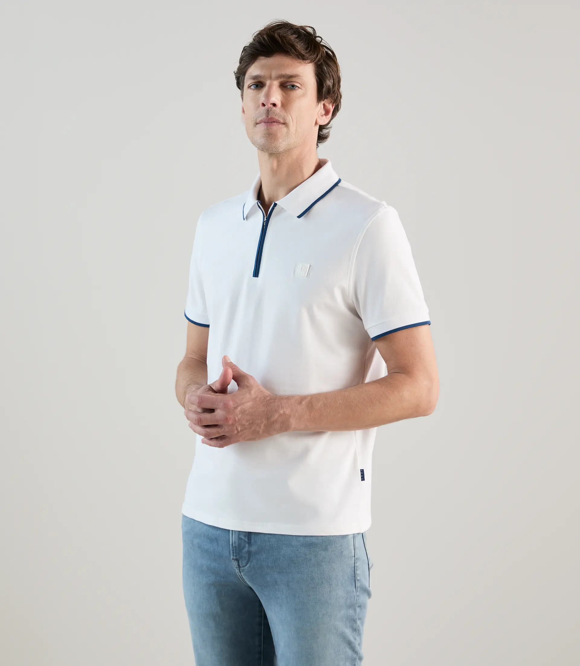 Polo à col zippé blanc